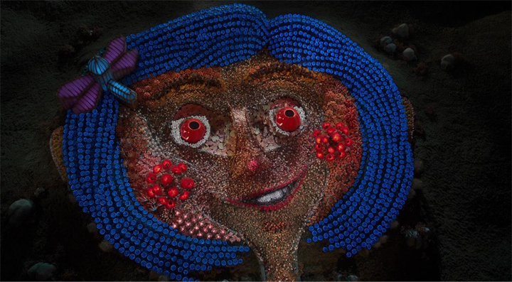 Girl's face created from glowing garden